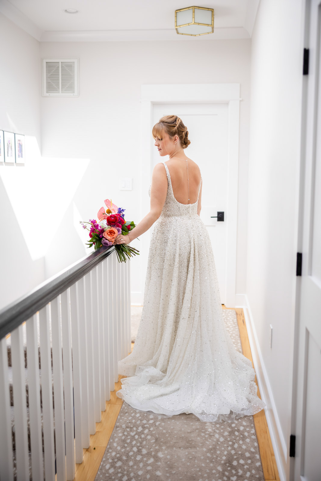 Bride standing by railing for District Winery Wedding