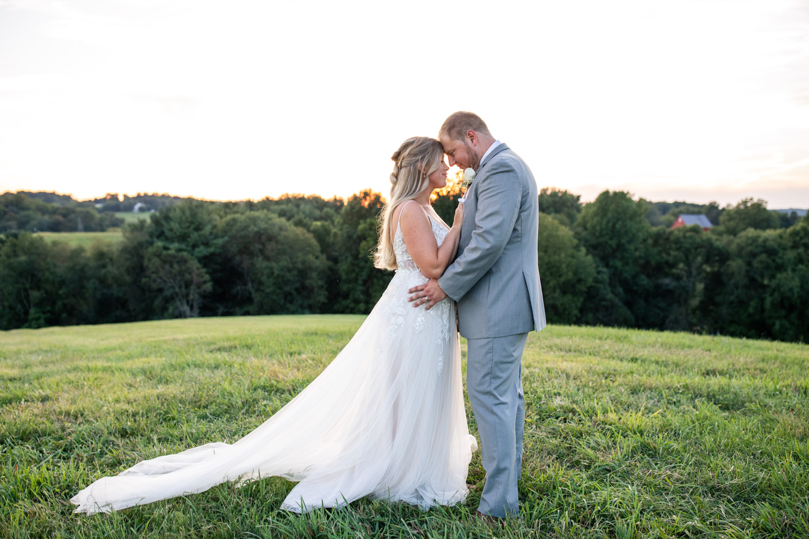 Couple posing in a field at Vignon Manor Farm in Harford County