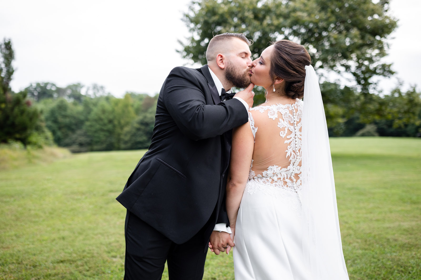 Couple kissing during bridal portrait session for a Rockfield Manor Wedding