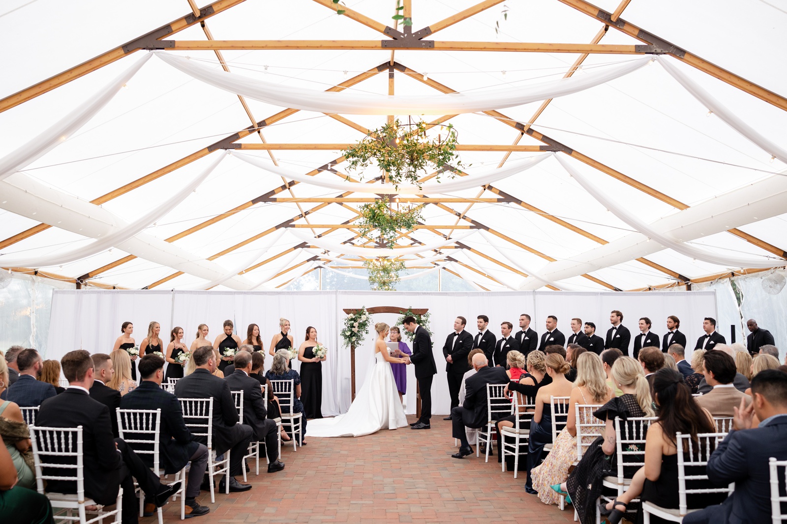 Tented wedding ceremony at Kent Island Resort