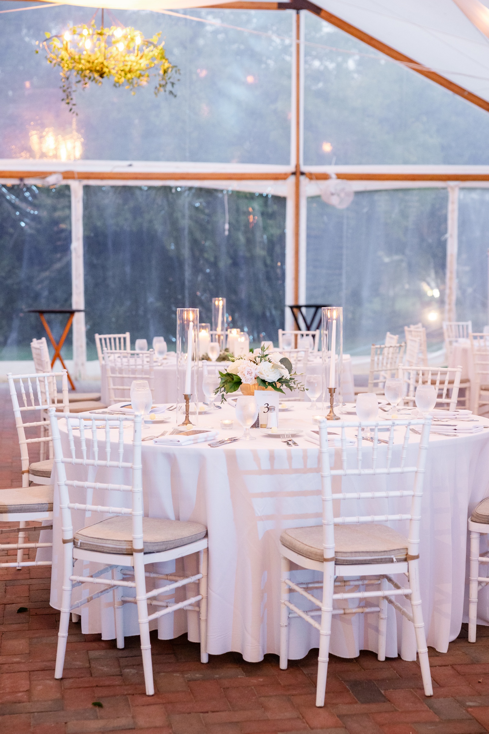 Tented wedding reception at Kent Island Resort in their Pavilion, with all white decor