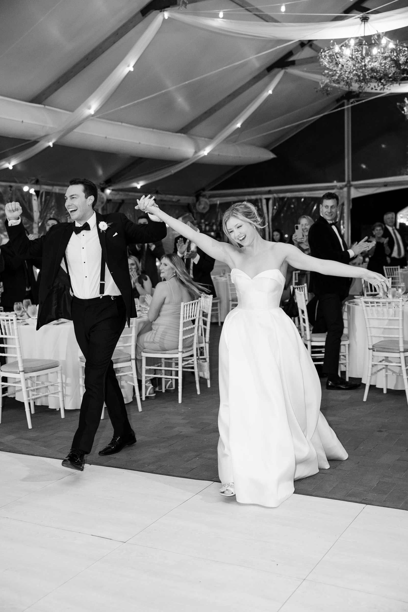 Bride and groom entering their wedding reception at The Pavilion at Kent Island Resort