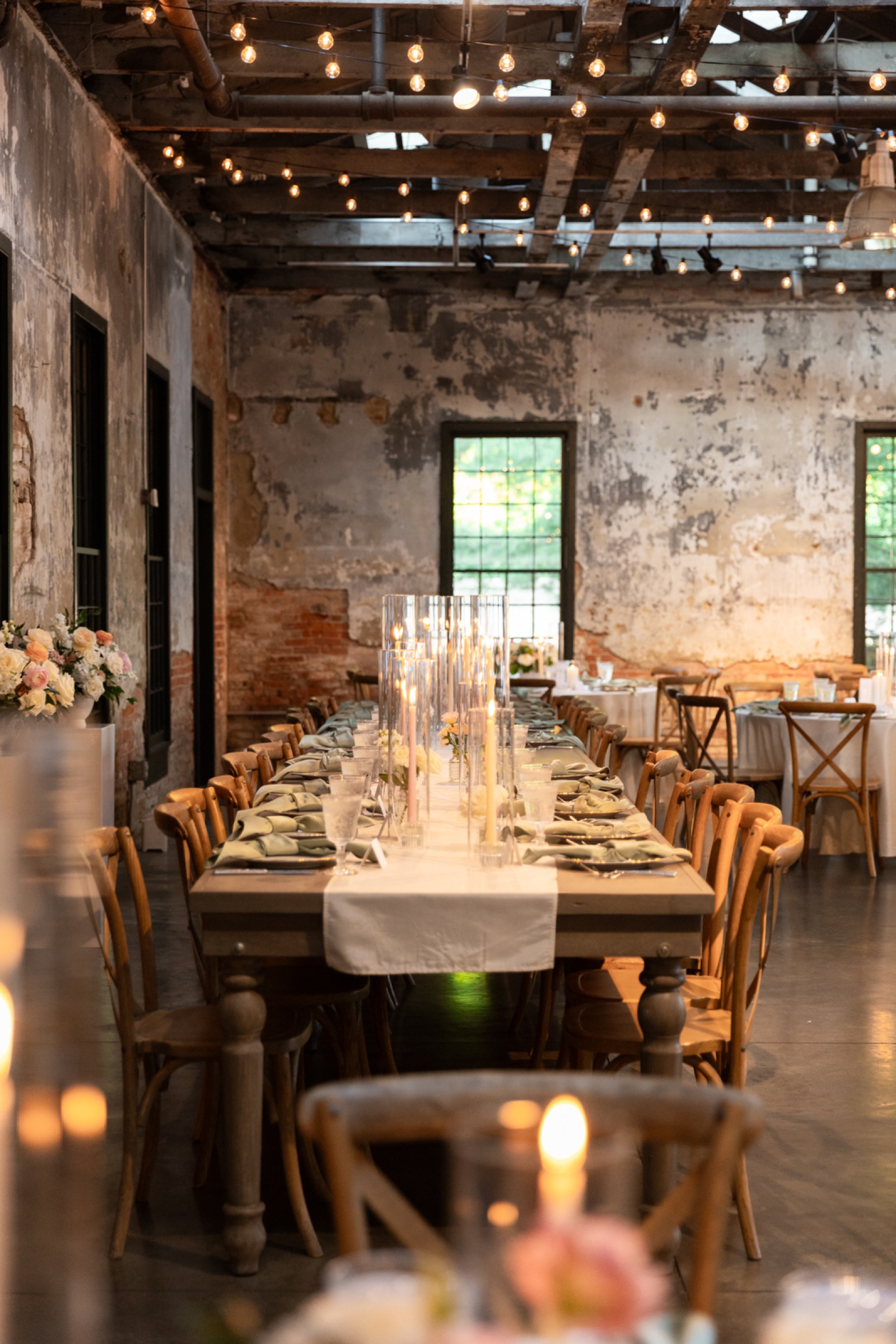 Wedding reception at Mt. Washington Mill Dye House with long wooden farm tables