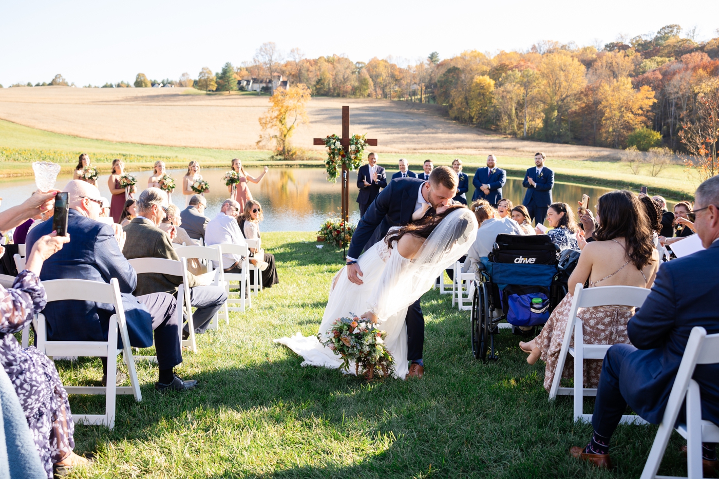 Groom dipping his bride at the alter 