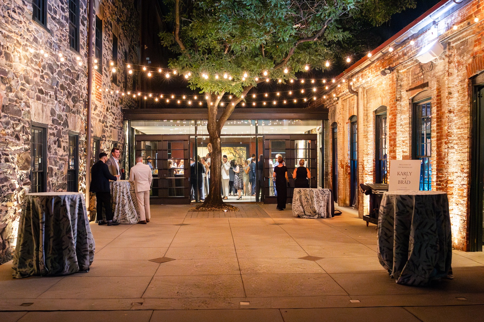 Evening courtyard at Mt Washington Mill Dye House with guests mingling