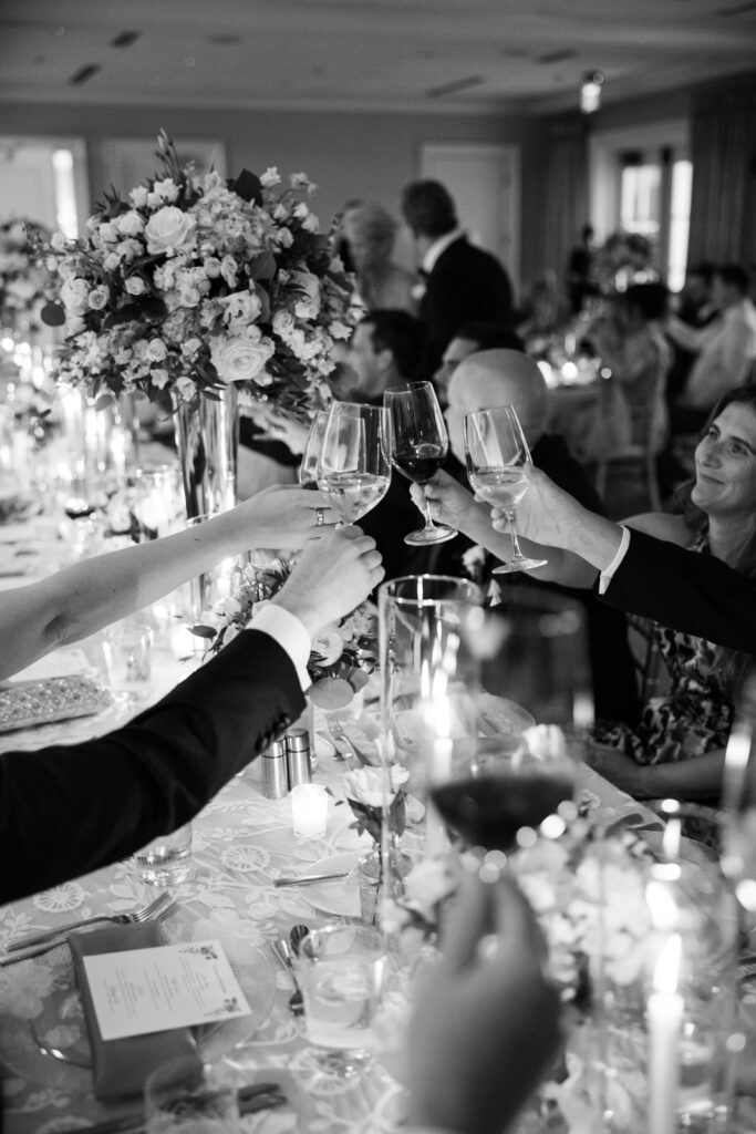 Ballroom reception at Woodmont Country Club with elegant décor and black-tie guests.