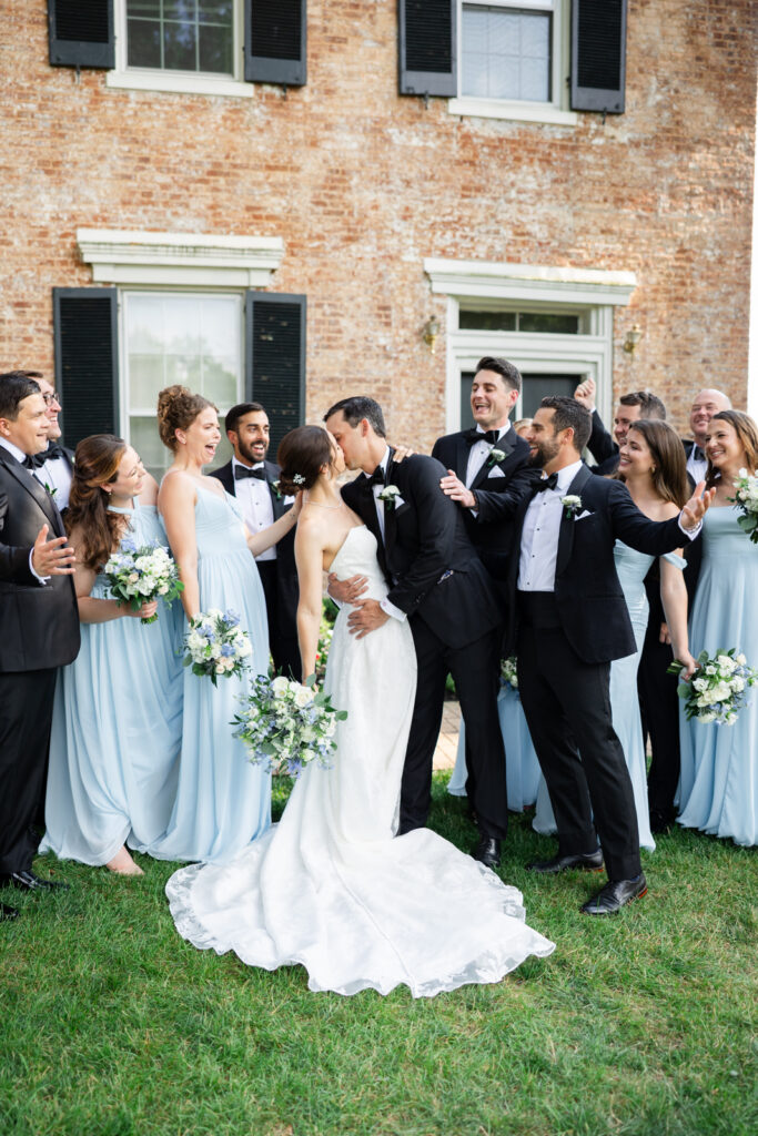 Bridal party portrait outside Woodmont Country Club during a summer wedding in Rockville, Maryland.