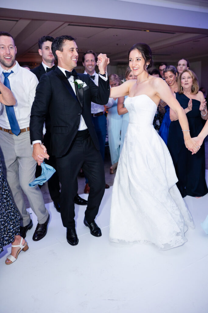 Ballroom reception at Woodmont Country Club with elegant décor and black-tie guests.