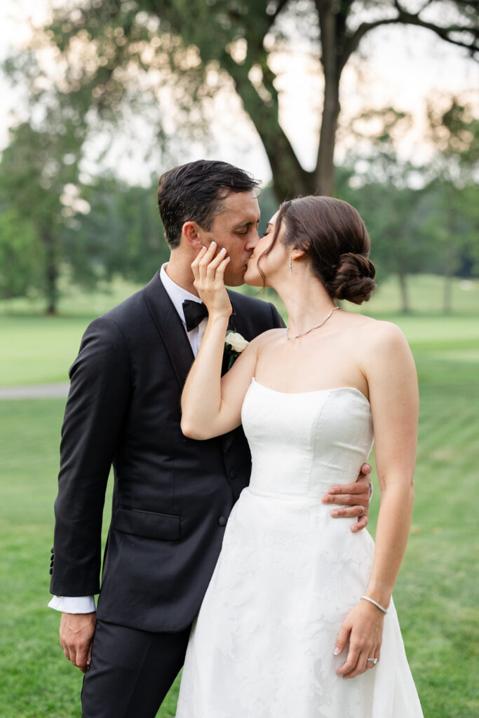 Bride and groom portraits on the greens at Woodmont Country Club during golden hour.