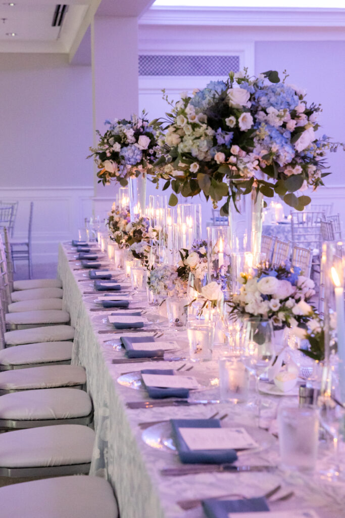 Elegant reception tablescape with florals and candles at Woodmont Country Club wedding.
