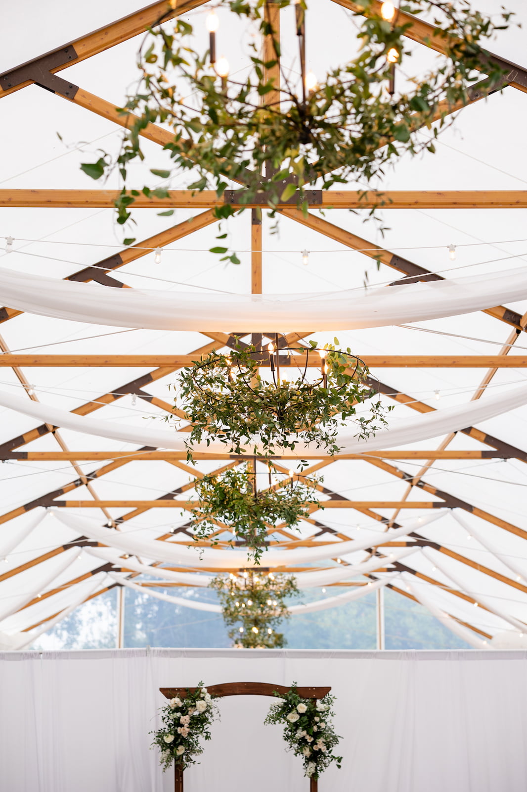 Hanging florals installation during a ceremony at the Pavilion at Kent Island Resort